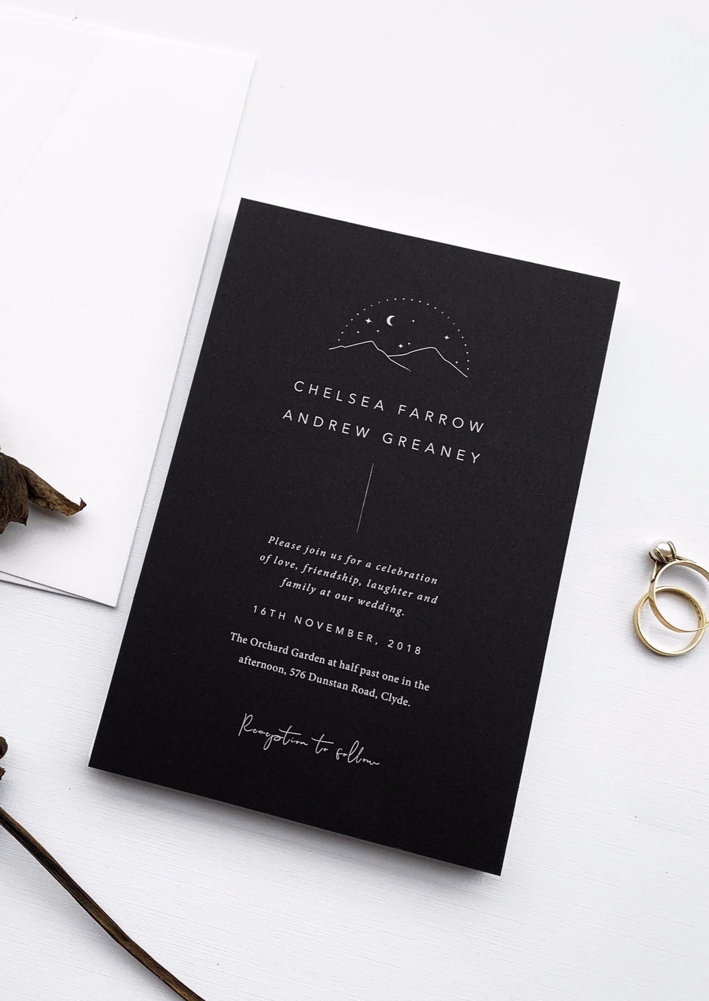 Night Sky, stars and moon with mountain illustration on wedding invitation by Smitten With Love. White ink printed onto black card. Designed and produced in New Zealand. Wedding Invitation. 
